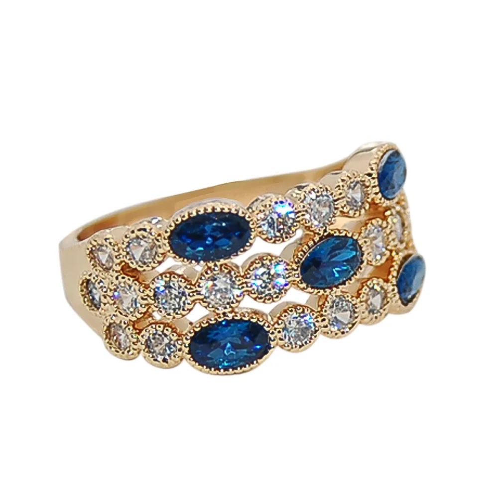 Anillo dorado con circonitas azules