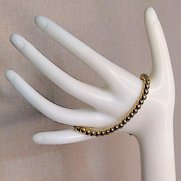 Pulsera mujer bolas acero doradas